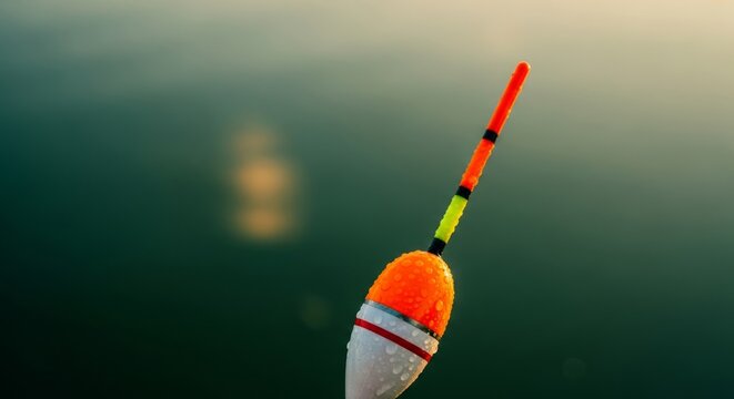 Fishing Float at Sunset with Water Droplets - Copy Space