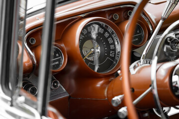 Fototapeta premium Vintage automobile dashboard featuring classic speedometer and controls
