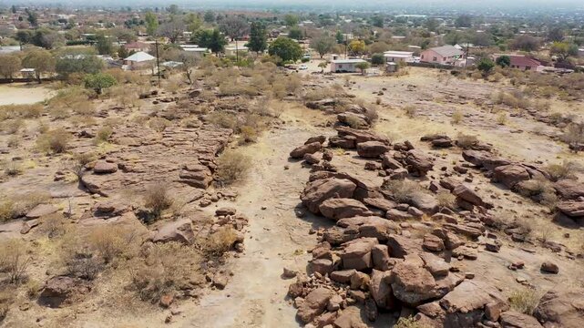 High-Angle View of Rocky Path Leading Toward Molepolole Village residential outskirts