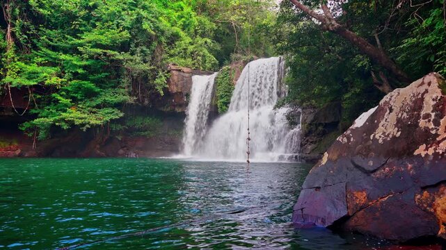 waterfall in a green forest