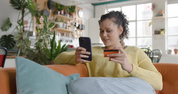 Young Adult Female at home using Phone for Online Banking