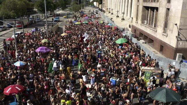 Drone Footage, Aerial View passing by crowd of people in the Brazilian Carnival Block Parade of Rio de Janeiro