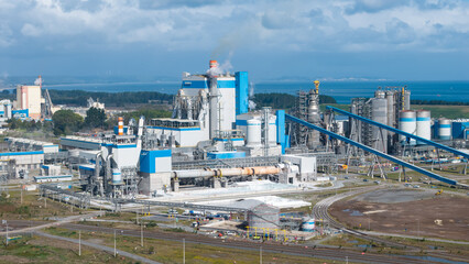 Obraz premium Bio Bio, Chile, March 24, 2026: Aerial shot of a massive pulp mill facility on the shores of Chile.