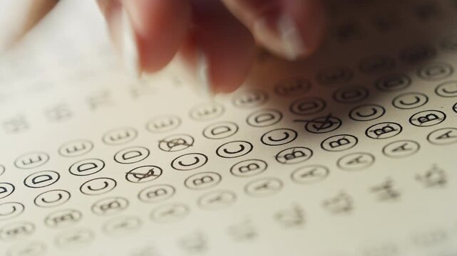 Female Student Correcting Wrong Answer During Exam Learning Process, selecting a new one. Correction.