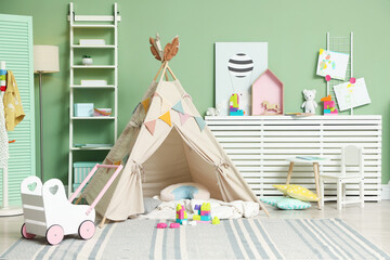 Cute wigwam and toys in stylish child's room © New Africa