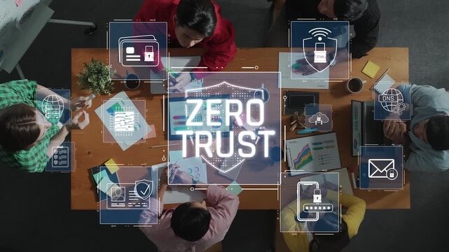 A top-down view of a collaborative workspace showcasing the Zero Trust cybersecurity concept with professionals engaging in strategic discussions around modern technology. Raster