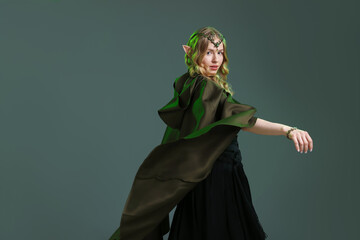 Naklejka premium Beautiful girl dressed as elf on grey background, space for text