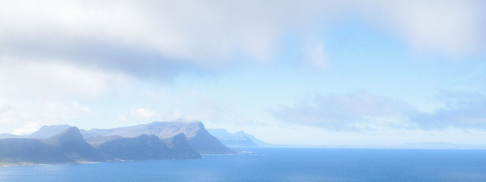 Minimal coastal landscape with mountains and blue sea, copy space