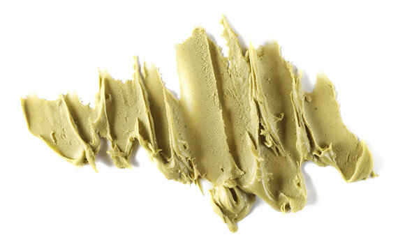 Pistachios spread isolated on white background, top view