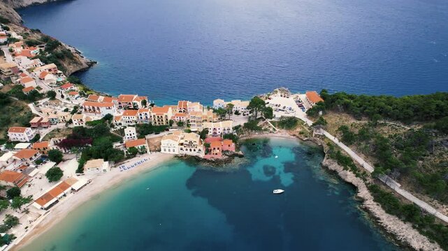 4K - Asos village, aerial view of this traditional settlment in Kefalonia (Kefallinia) island in Ionian Sea, Greece, Europe. It's built upon a strip of land between a fishing port and the sea.  
