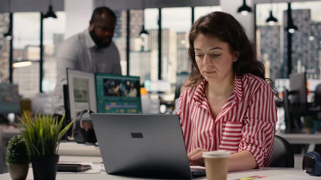 Portrait of businesswoman inside open space office environment, creative agency staff planning strategy for development and management. Employee consultant in smart office corporation.