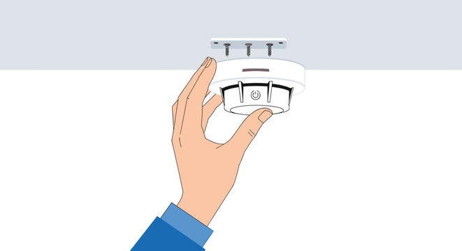 Hand holding smoke detector for home safety and security a crucial device for fire prevention and protection