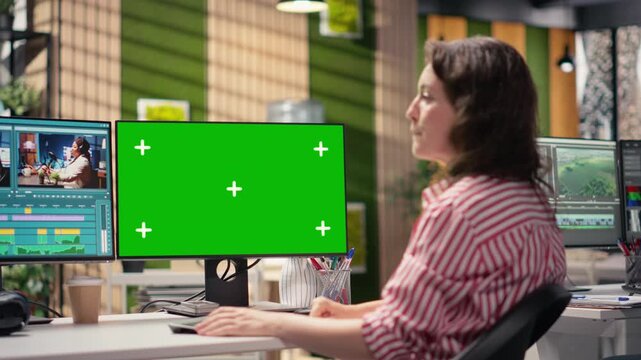 Chroma key and cinematic film footage with woman video editor on computer in production studio. Screen shows raw clips, cutting tools and motion graphics visual effects in movie post production.