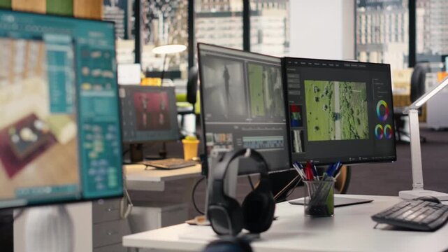 Empty office with architectural software shown on PC monitor in smart workspace, showcasing blueprint drafting and 3D floor plan remodeling on screen. Creative agency in office environment.