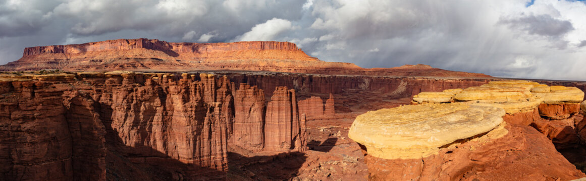 This scenic panorama of Canyonlands National Park features Monument Basin with the Island in the Sky rising above.