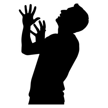 Silhouette of a man looking up with hands raised in despair.