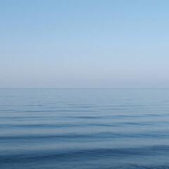 Obraz premium Graffiti Sea Calm. A Tranquil, Minimalist Landscape Featuring A Serene Blue Sea Surface And Clear Skies