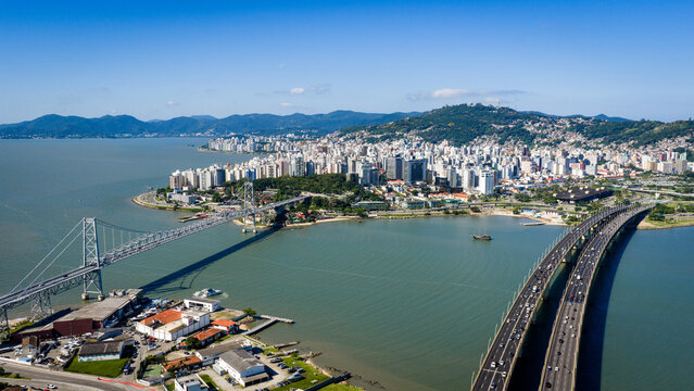 Aerial view of Herc&iacute;lio Luz Bridge in Florianopolis Brazil with downtown skyline and surrounding bay.
