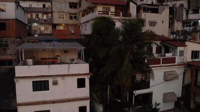 Drone Footage, Aerial view of Favela and Morro houses Located in Catete Rio de Janeiro in the morning light sun