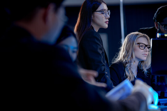 Building tomorrow AI tonight deep focus diverse engineers code train complex models multi screen setup innovation lab intense collaboration future tech taking shape now project crunch.