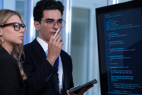 Positive code review vibes. Smiling tech lead guides colleague explaining successful script screen reflects collaborative synergy modern development hub winning team builds next big thing now.