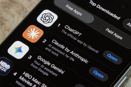 Portland, OR, USA - Apr 14, 2026: ChatGPT, Claude by Anthropic, and Google Gemini, the top 3 most downloaded free apps in Apple's App Store as of April 14, 2026. AI competition concepts.