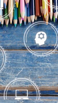 Vertical video: HUD icons appearing, pencils sliding on blue wood, moving, forming learning tech