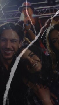 Vertical video: Singer singing sparking trio posing at concert phone up for pic scratches crossing