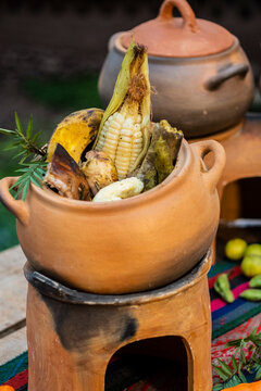 Traditional pachamanca meal cooking in peruvian clay pots