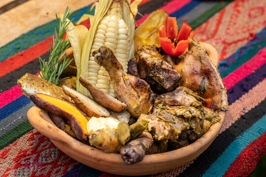 Pachamanca traditional peruvian food displaying roasted meats and vegetables