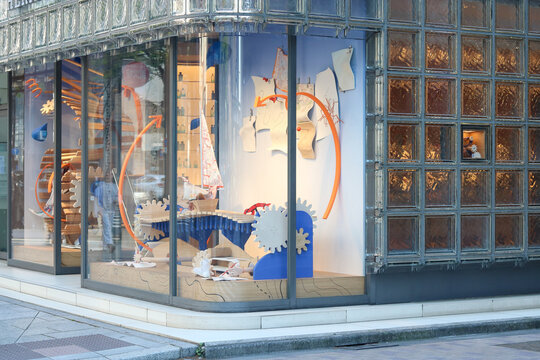 TOKYO, JAPAN - April 8, 2026: Detail of Maison Hermes Ginza including a window display.