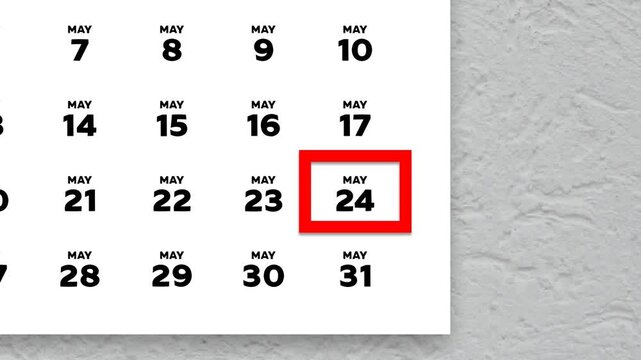 The date May 24th marked with a red cursor on the wall calendar 2026