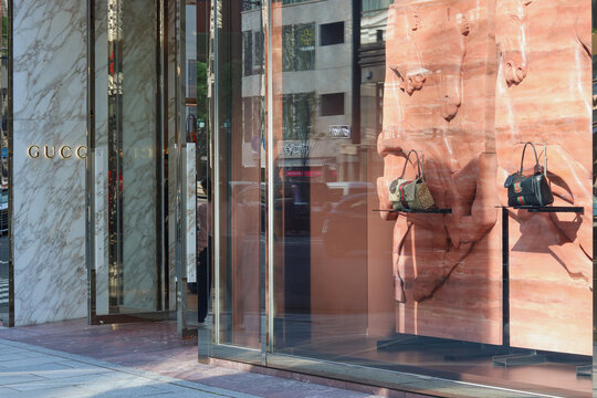 TOKYO, JAPAN - April 8, 2026: Bags on display in the window of a Gucci store in Ginza.