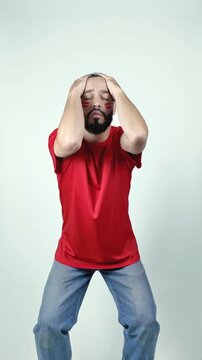 Disappointed soccer fan reacting during game