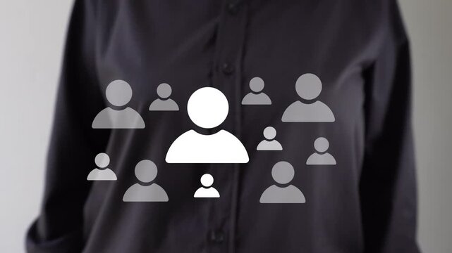 Businessperson pointing at an animation highlighting different avatars of people; a concept related to personnel selection.