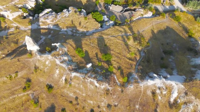 Goreme, Nevsehir, Turkey. Aerial shot of Gorkundere Rocket Valley, showcasing its surreal forest of rocket-shaped and towering rock spires.. Aerial View, MasterShots, Tilt up, Zoom In
