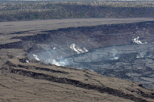Close view of steam rising from vents along the rugged crater walls of Kilauea in Hawaii Volcanoes National Park Hawaii