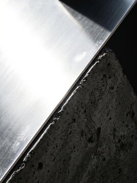 Close-up of Industrial Metal and Rough Concrete Texture