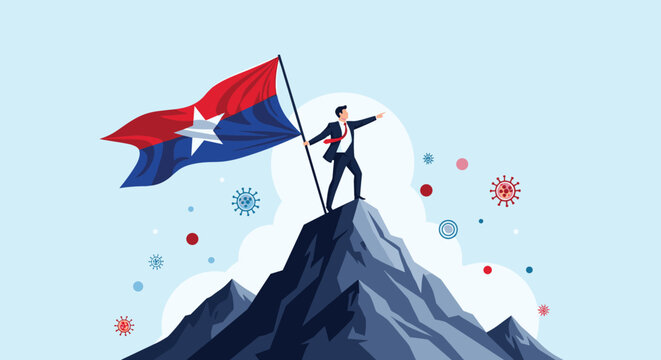 Determined businessman standing on top of a high mountain peak and planting a flag while pointing forward amidst a clear blue sky background.