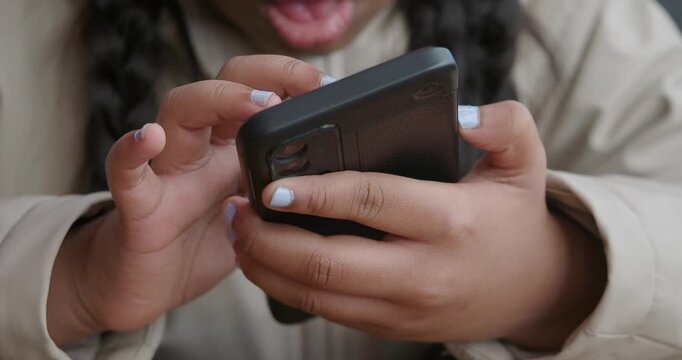 little girl uses smartphone to communicate 