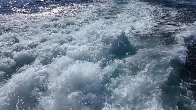 Waves crashing on a boat in open water