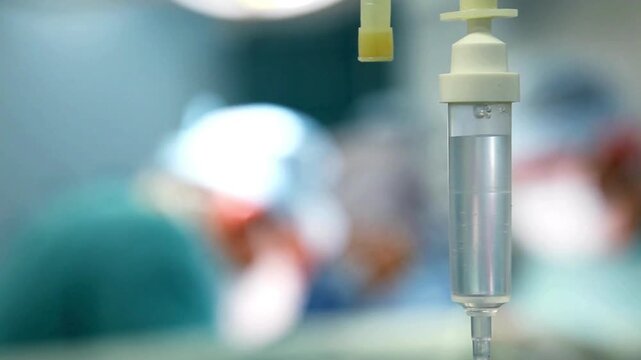 medicine IV drip to a patient medicare and intravenous medication or infusion of morphine, blurred background HD of eldery person receiving medication
