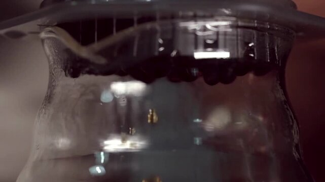 close up droplet from automatic coffee maker caffeine working filtration in footage HD backgrounds