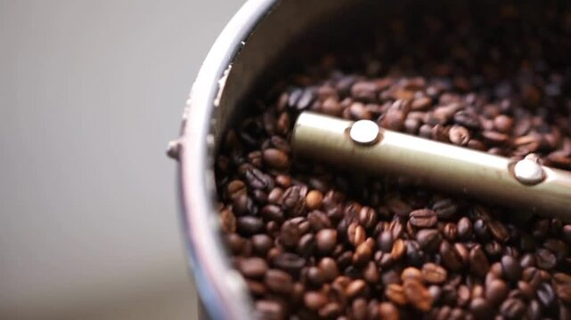 hot black roasted coffee bean in machine cooling roastery machine industrial coffee house shop barista making top quality kopi beans