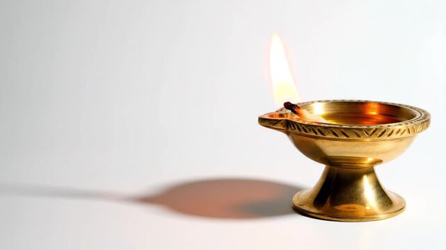 White background with one diya and soft warm shadow, clean devotional style,