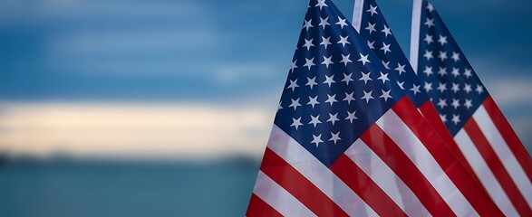 American flags waving against a blurred blue and white background