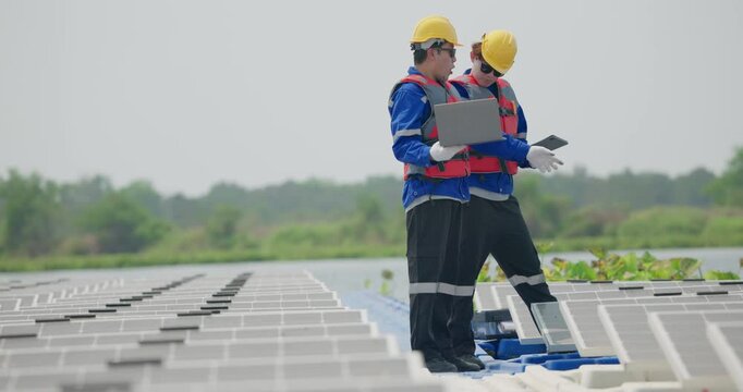 Software engineers collaborate, discuss ways to enhance a smart energy analytics app for floating solar operation. Real-time monitoring optimizes data usage, analyzes efficient consumption insights.
