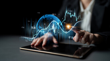 A professional analysis session showcasing digital financial data on a tablet, emphasizing global...