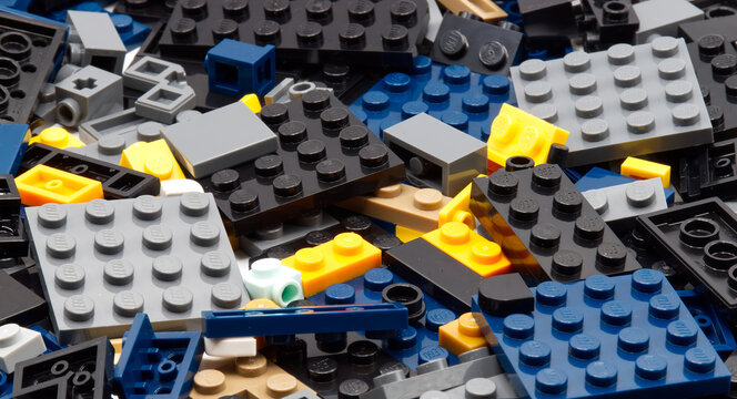 Bologna - Italy - April 14, 2026: Top view of interlocking plastic LEGO construction bricks isolated on white background.