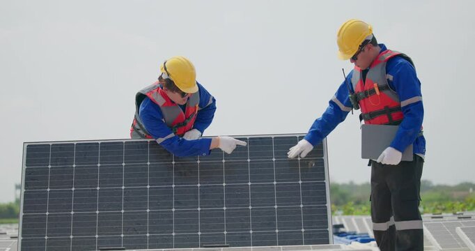 Software engineers collaborate, discuss ways to enhance a smart energy analytics app for floating solar operation. Real-time monitoring optimizes data usage, analyzes efficient consumption insights.
